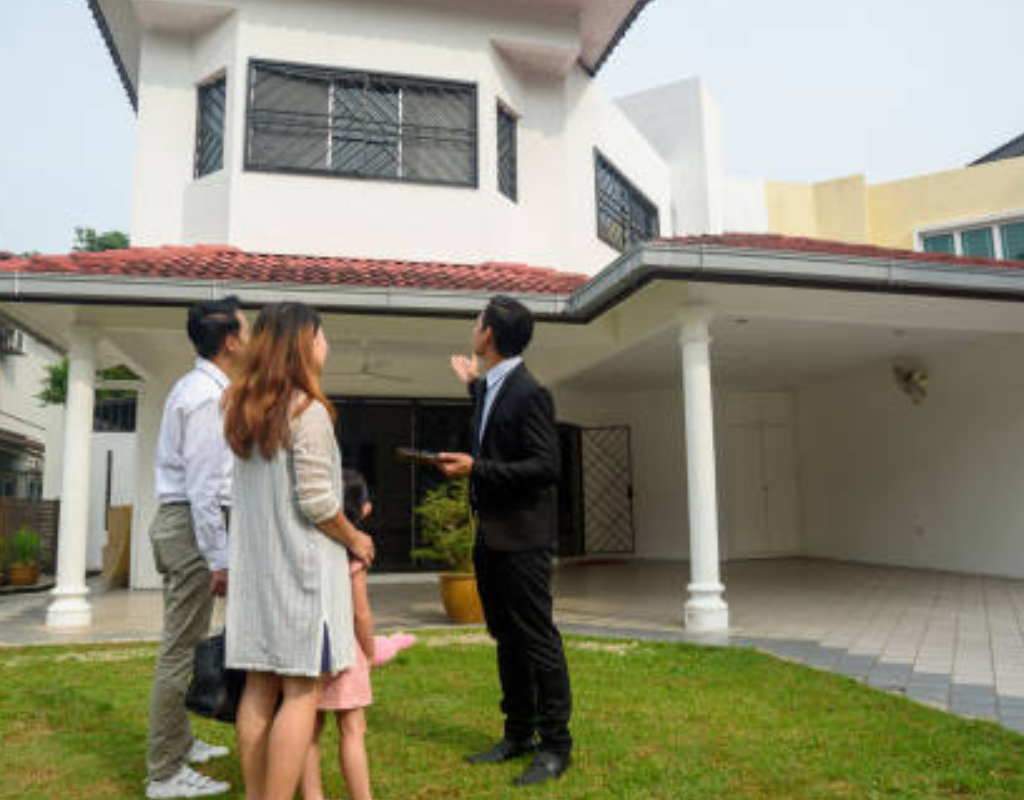 Real estate agent showing new home to clients stock photo